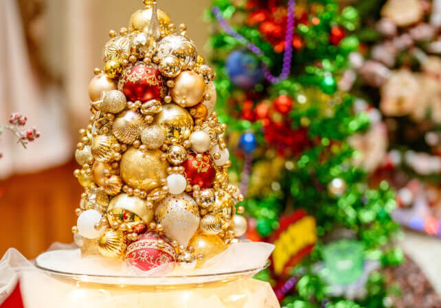 Small decorated Christmas tree with ornaments and lights